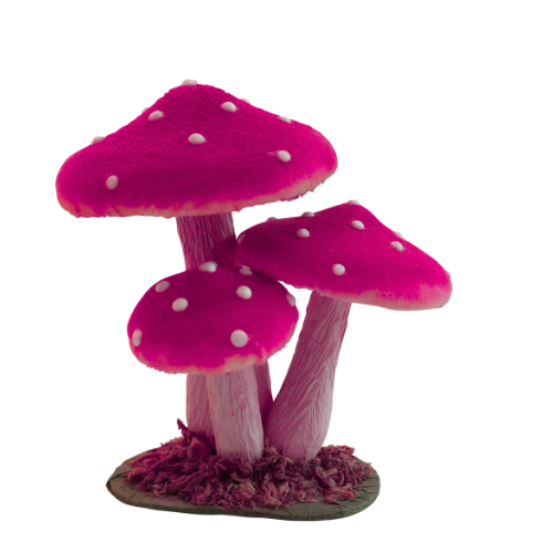 Three vibrant pink mushrooms with white spots, set on a small mound of textured grass, against a transparent background.
